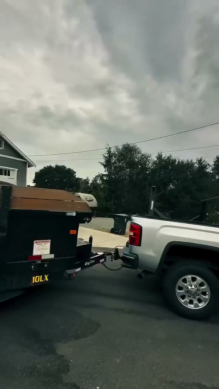 The Bay Area Bin Rental pickup towing the bin trailer